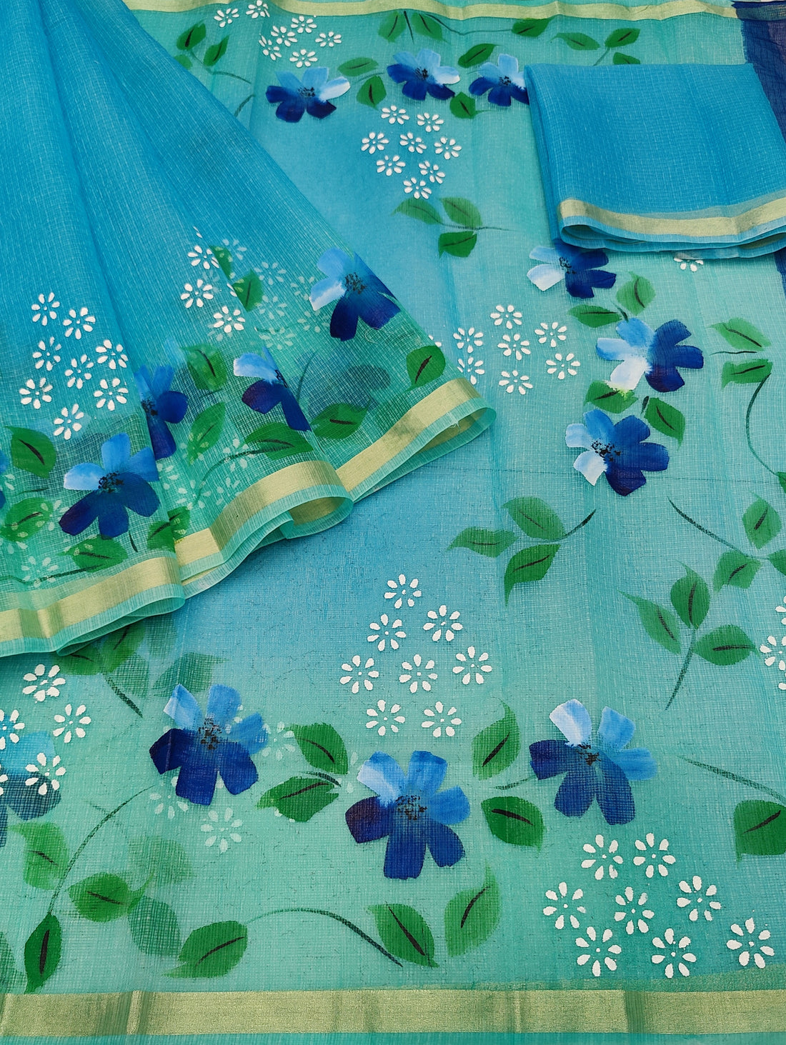 Sky-blue Cotton Kota Doria Hand Painted Saree With Sea-green Border & Contrast Blouse Piece.