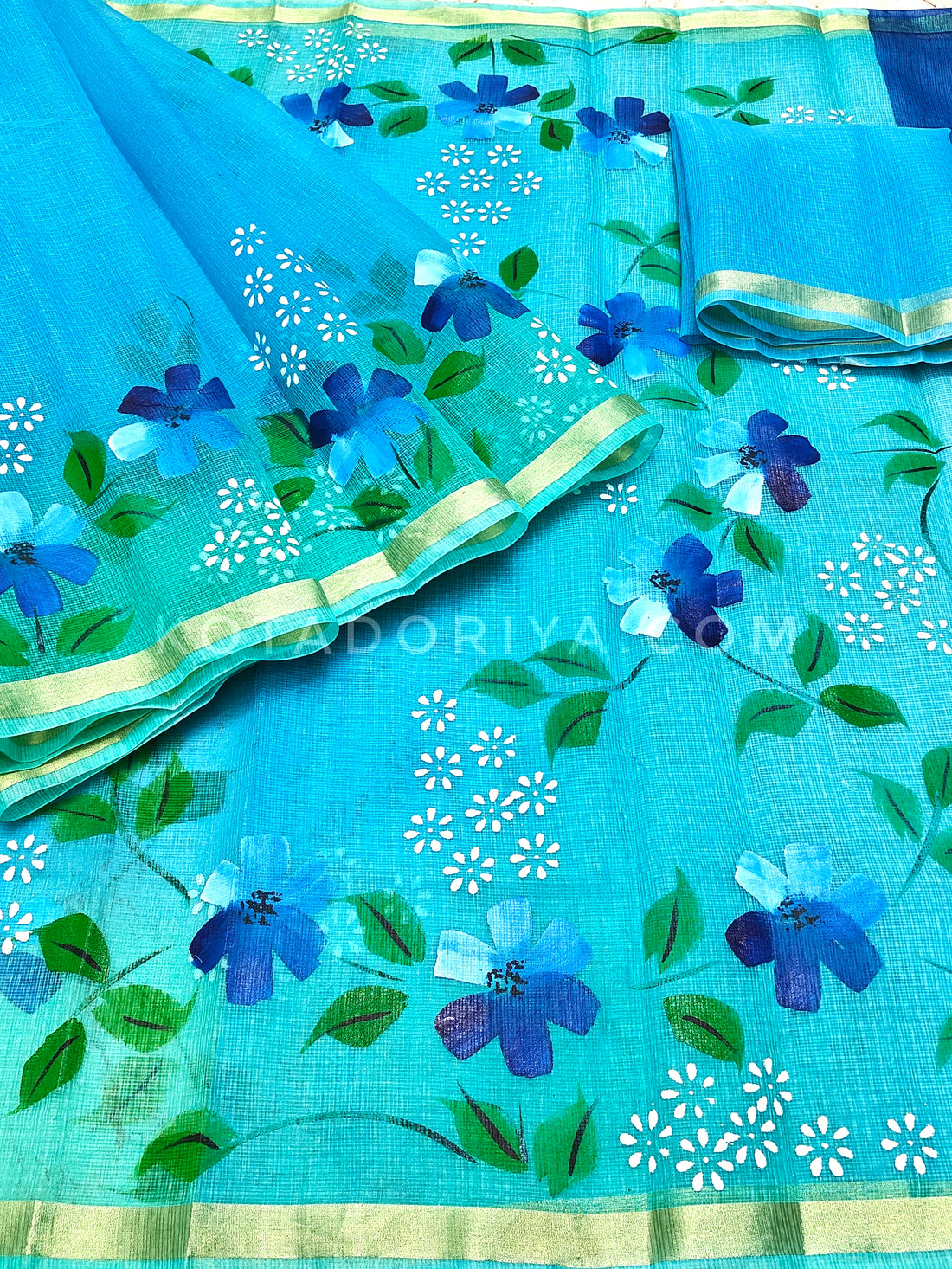 Sky-blue Cotton Kota Doria Hand Painted Saree With Sea-green Border & Contrast Blouse Piece.